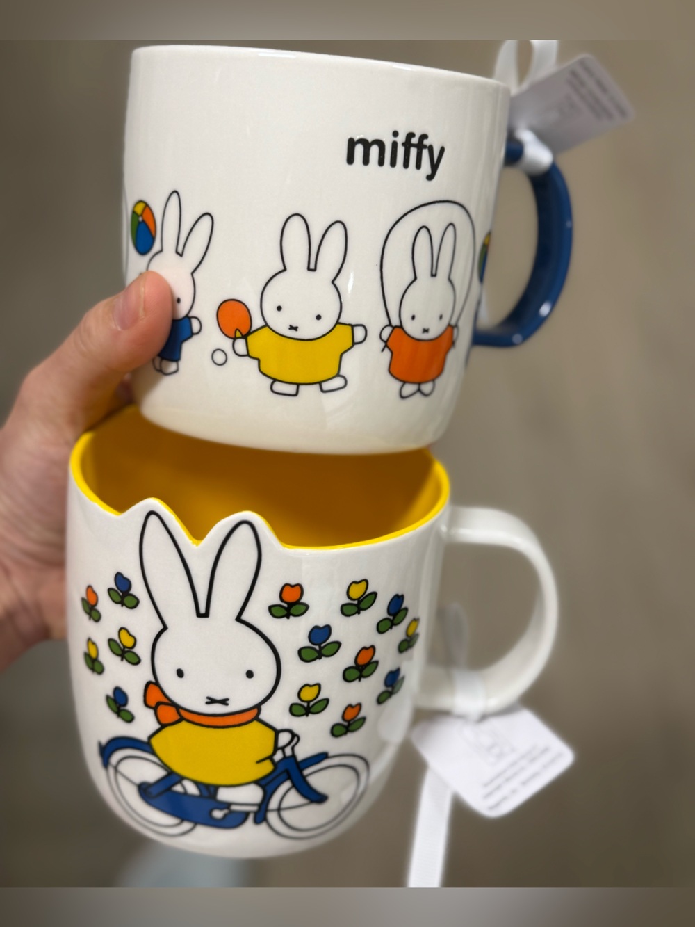 miffy white 2 ceramic mugs with yellow interior and multicolor designs